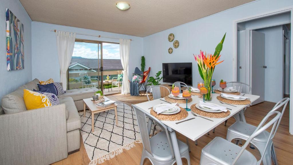 a living room with a white table and a couch at Armstrong Ridge in Gerringong
