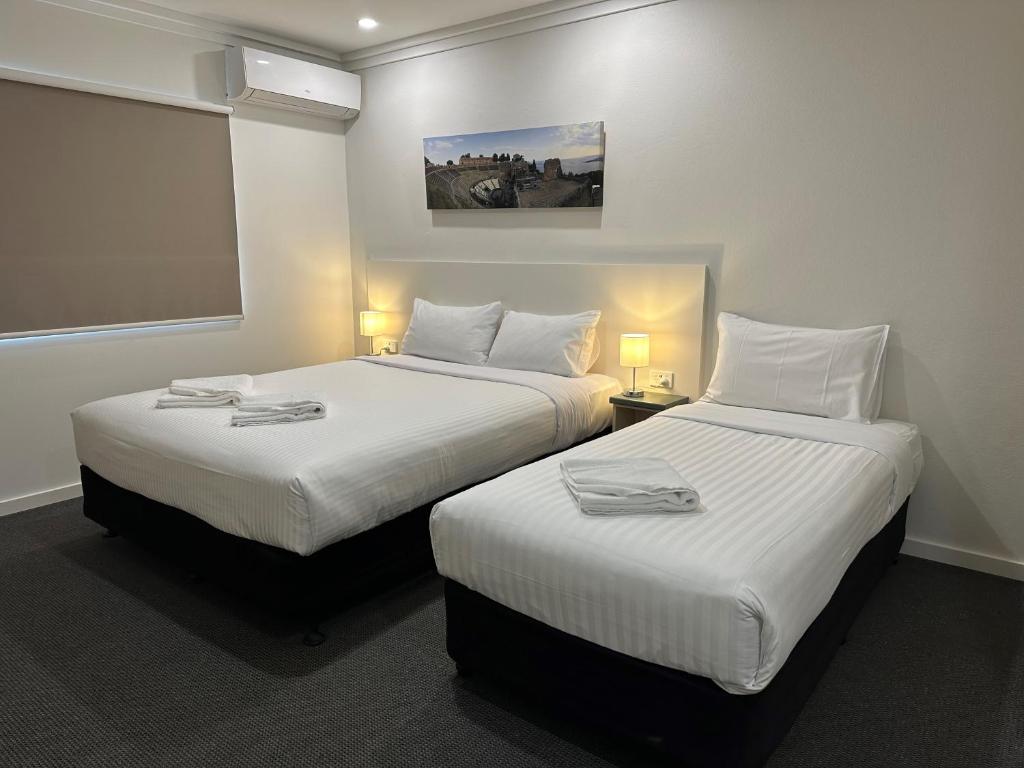 Postel nebo postele na pokoji v ubytování Golf View Motel
