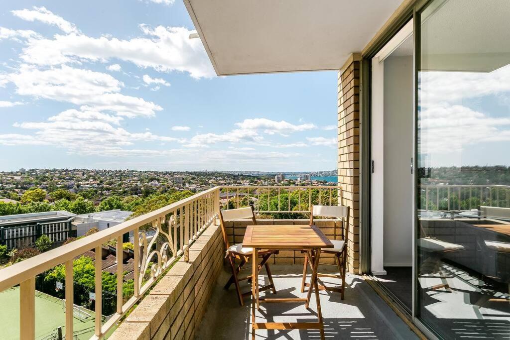 a balcony with a table and a view of the city at CRE31 - renovated 1 bedroom unit - Cremorne in Sydney