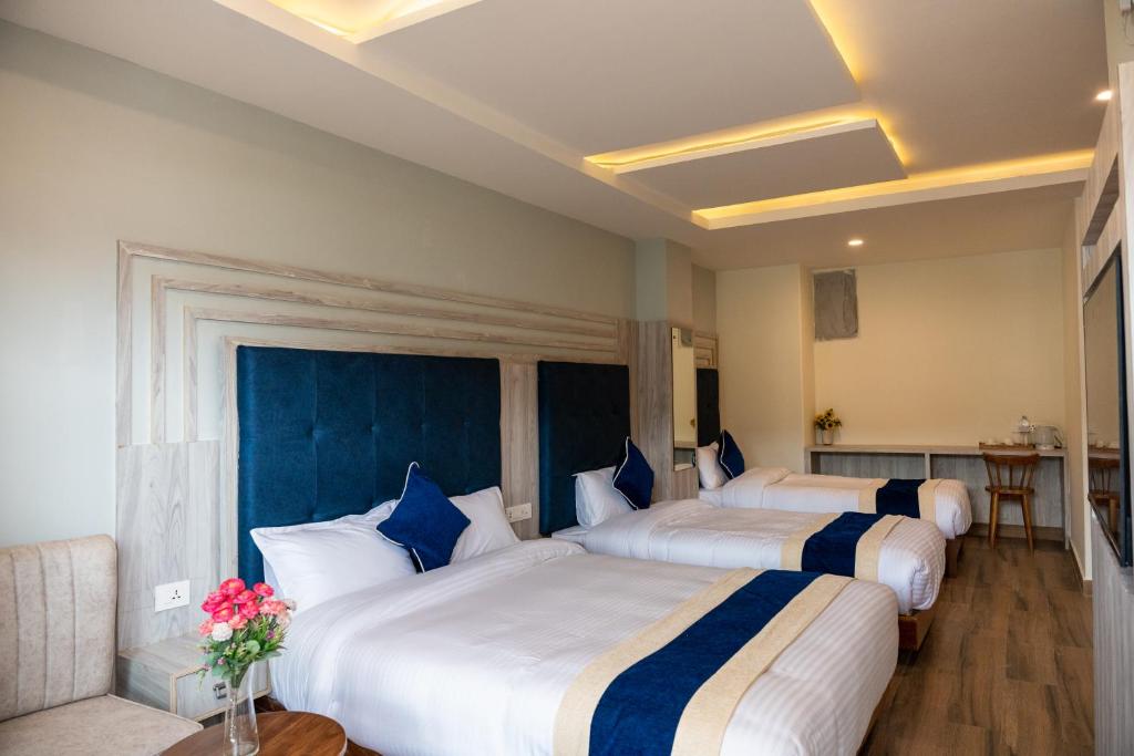 Cama o camas de una habitación en Hotel Adam