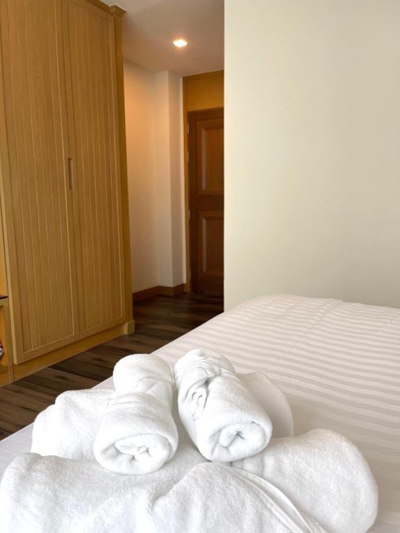 Postel nebo postele na pokoji v ubytování Baannalin Hometel บ้านนลิน โฮมเทล