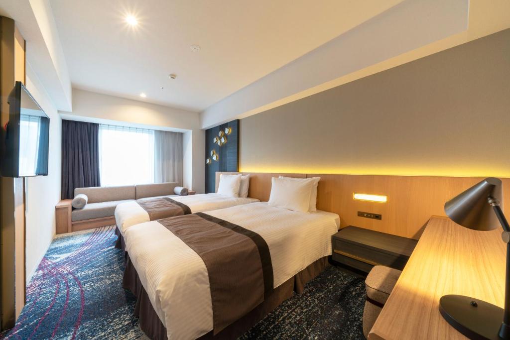 Hotel JAL City Nagoya Nishiki房間的床