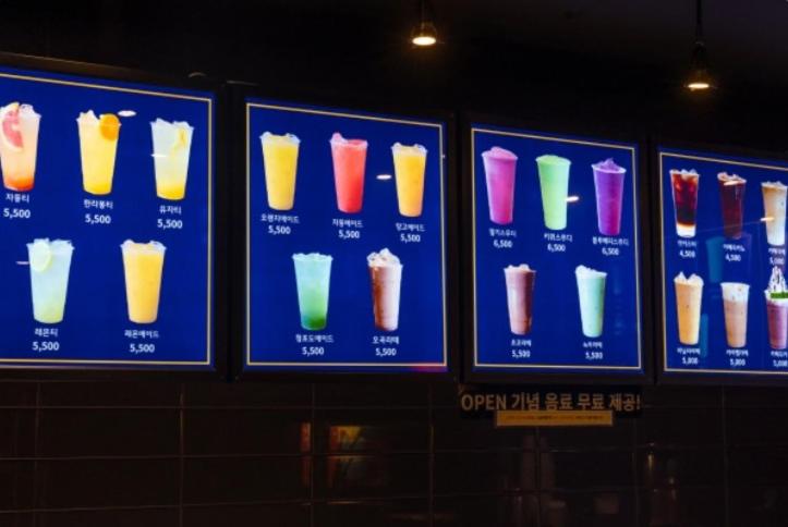 a group of signs with different types of drinks at You&Me Hotel in Seongnam