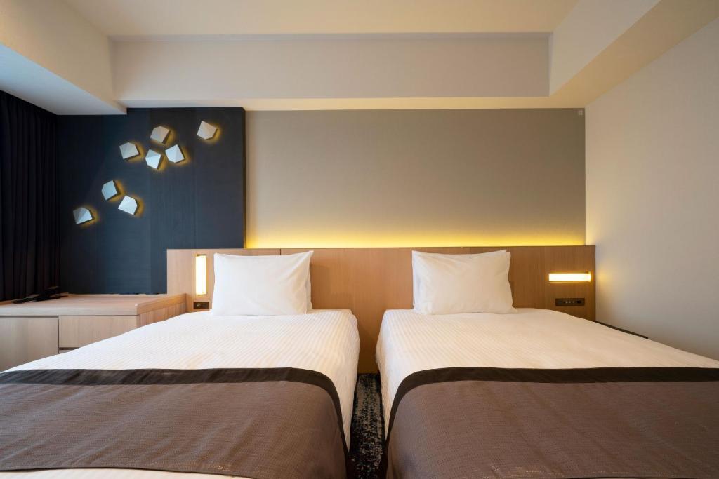 Hotel JAL City Nagoya Nishiki房間的床