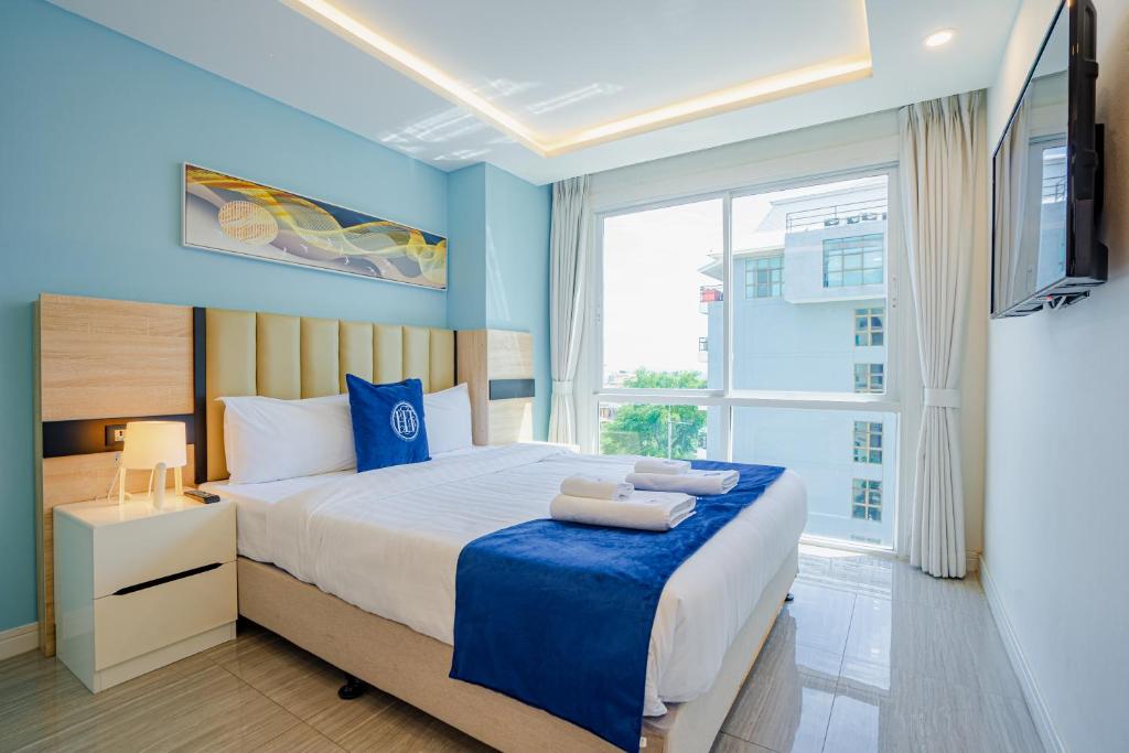 Postel nebo postele na pokoji v ubytování HT9 Hotel