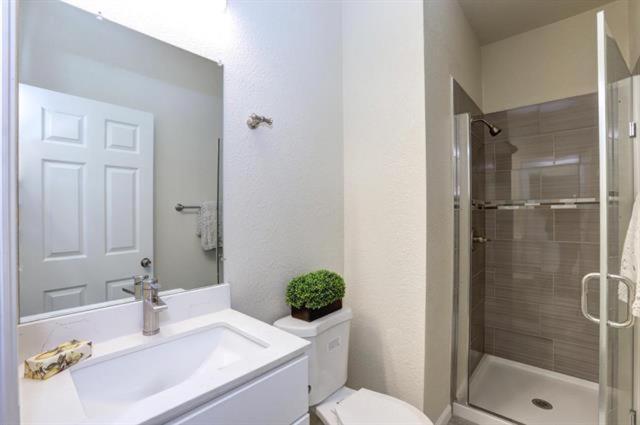 a bathroom with a sink and a toilet and a shower at San Jose Shark House - Unit 2 in San Jose