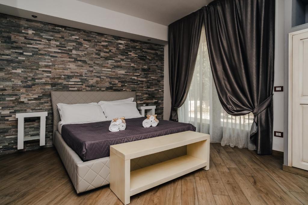 Postel nebo postele na pokoji v ubytování Holiday Gli Archi