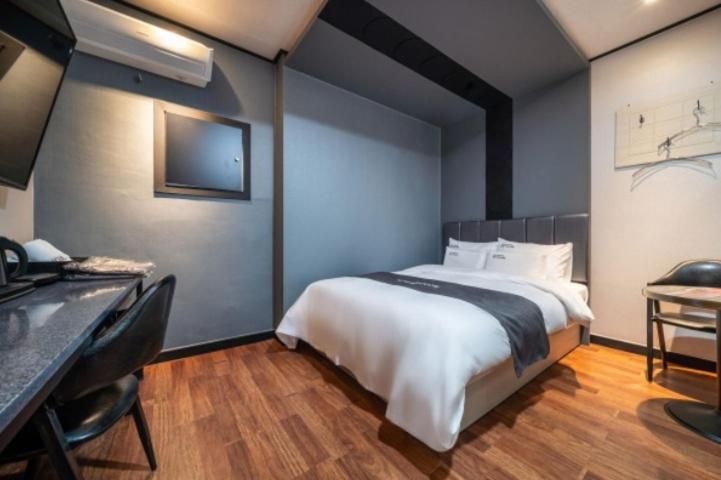 Postel nebo postele na pokoji v ubytování You&Me Hotel