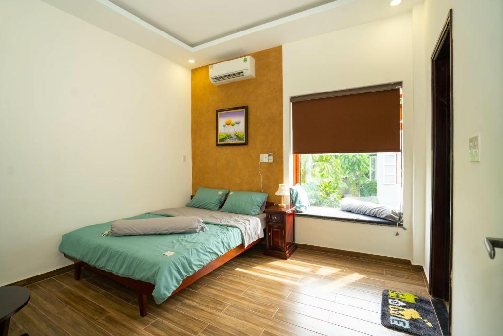 Postel nebo postele na pokoji v ubytování Tâm Family Homestay-Huế