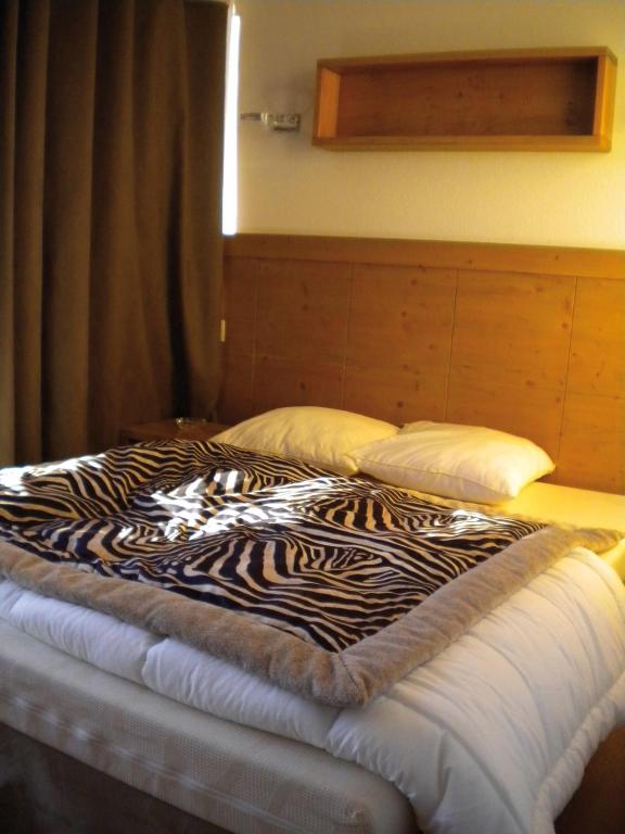 Postel nebo postele na pokoji v ubytování Lagrange Vacances Le Roc Belle Face