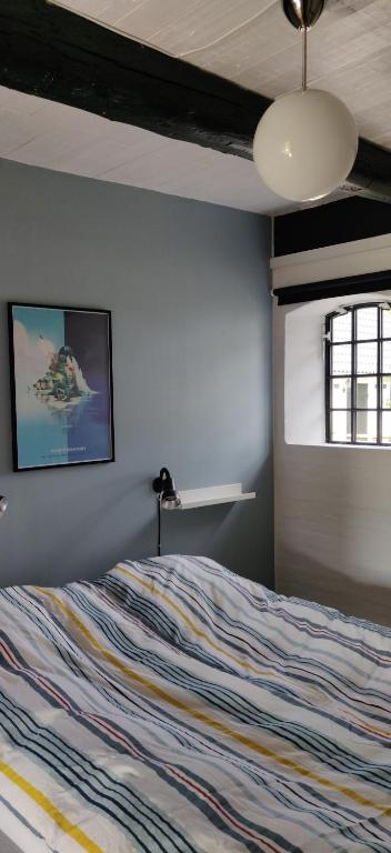 Postel nebo postele na pokoji v ubytování Fuglsanggaard Stalden
