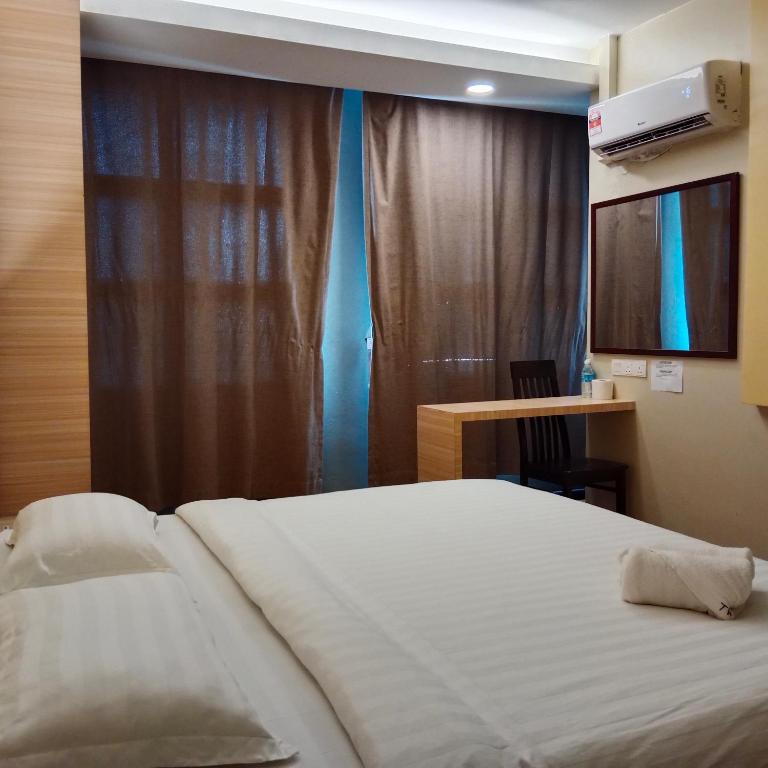 Postel nebo postele na pokoji v ubytování TOWERMAS HOTEL