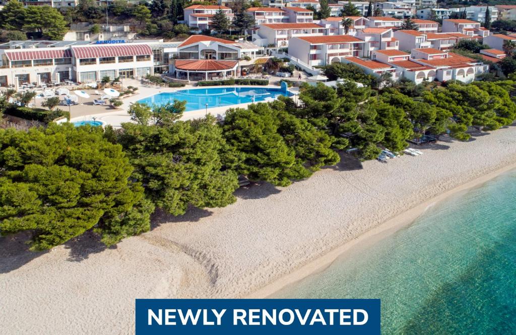 an aerial view of a resort with a sandy beach at Bluesun Holiday Village Afrodita in Tučepi