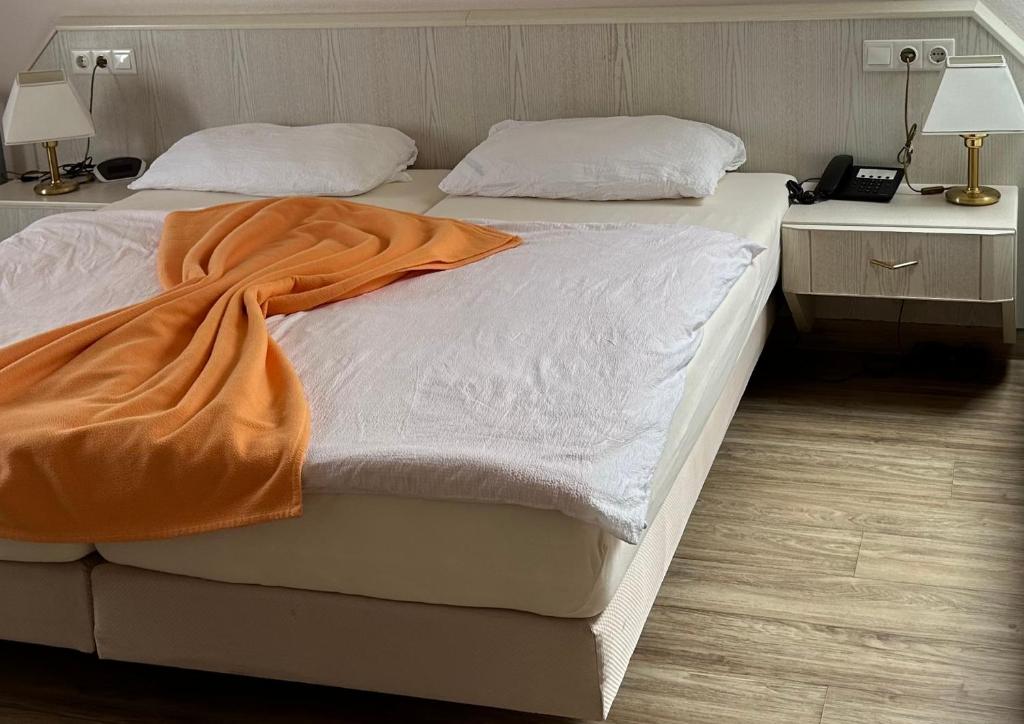 Postel nebo postele na pokoji v ubytování Hotel Garni Classico