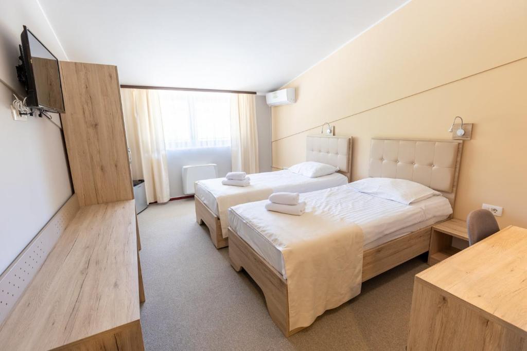 Postel nebo postele na pokoji v ubytování Hotel Dolenjc