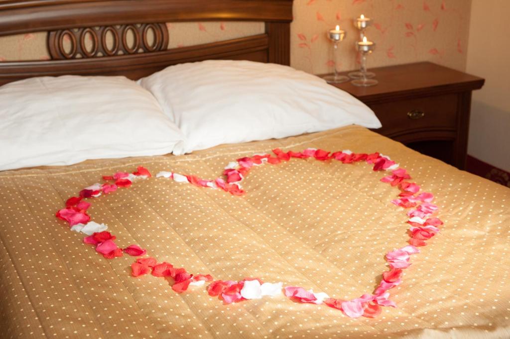 Posteľ alebo postele v izbe v ubytovaní Hotel Arkadia Royal