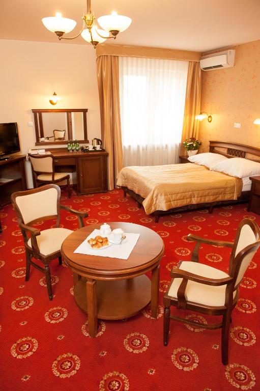 Posteľ alebo postele v izbe v ubytovaní Hotel Arkadia Royal