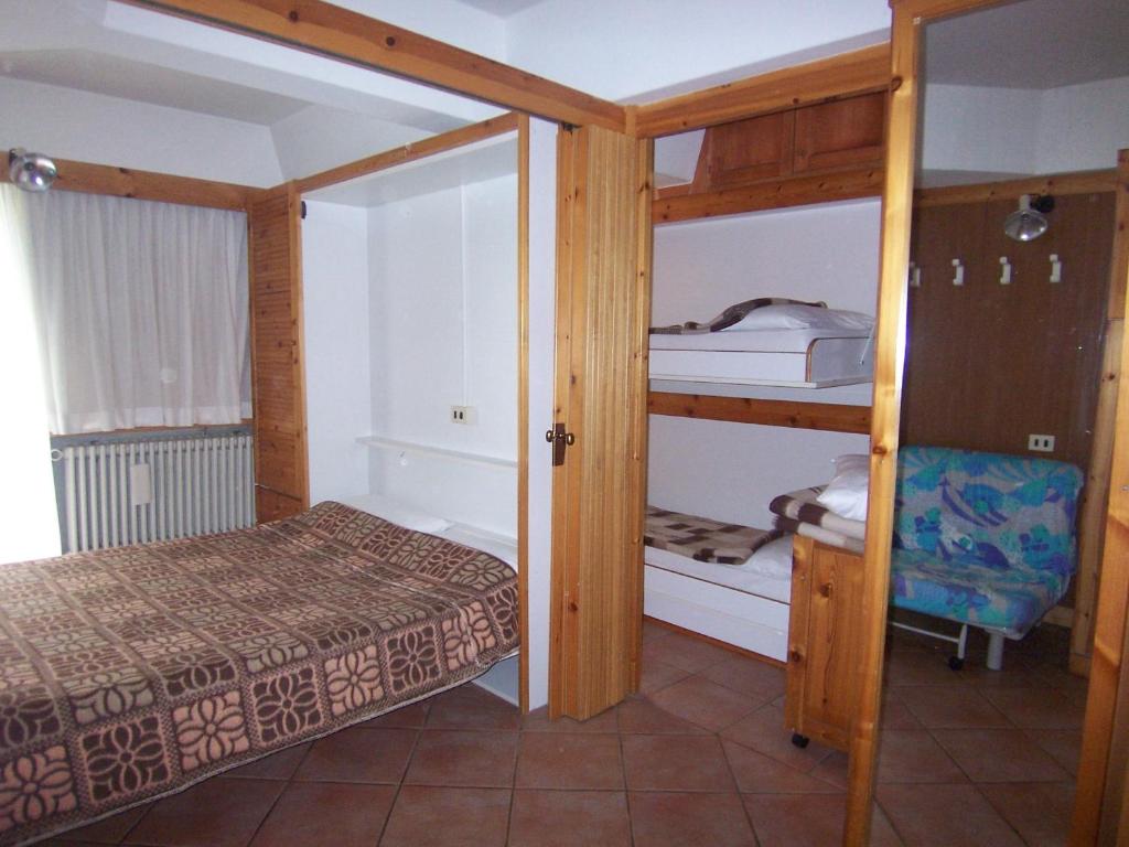 Postel nebo postele na pokoji v ubytování Residence Artuik Appartamenti Solandra