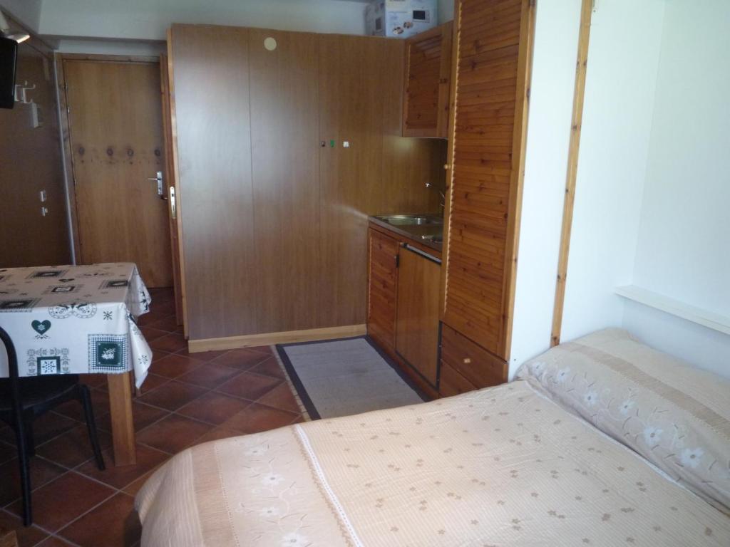 Postel nebo postele na pokoji v ubytování Residence Artuik Appartamenti Solandra