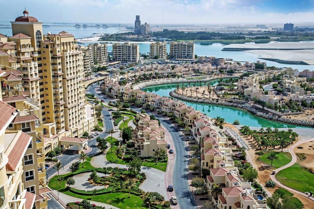 an aerial view of a city with buildings at Sea View Studio 5 Royal Breeze سي ويو ستوديو رويال بريز in Ras al Khaimah