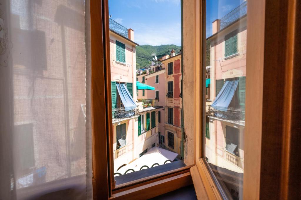 a view of a city from a window at Appartamento Piccolo Principe in Monterosso al Mare