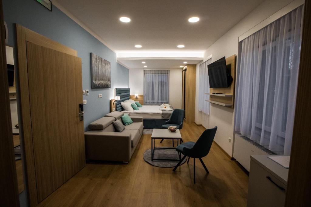 TV a/nebo společenská místnost v ubytování Klečka vila B&B rooms