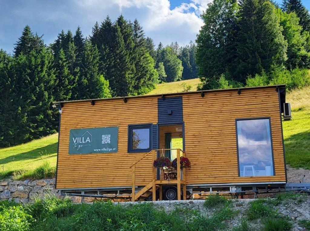 a tiny house sitting on top of a hill at Tinyhaus Villa to go in Reichenau