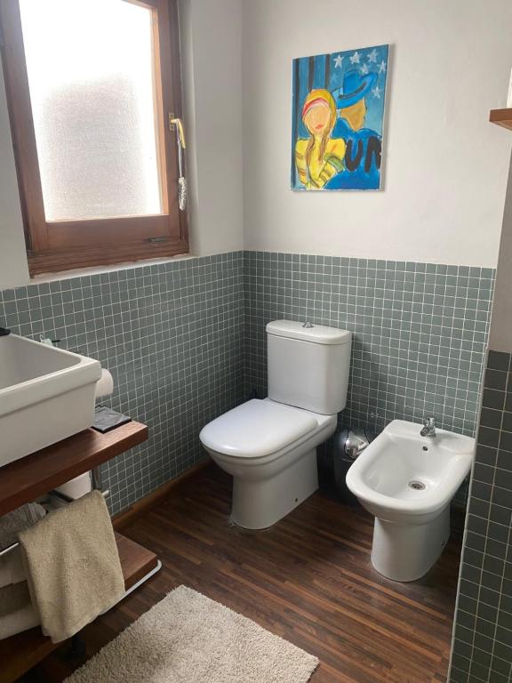a bathroom with a toilet and a sink at A luxiourious Room in the best terraced Penthouse in Denia Building 3 in Denia