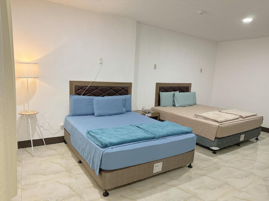 Postel nebo postele na pokoji v ubytování MGH Alona Resort