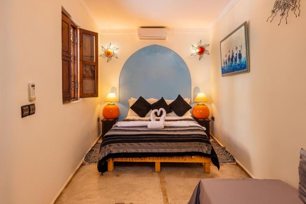 Postel nebo postele na pokoji v ubytování Riad Sidi Mimoune & Spa