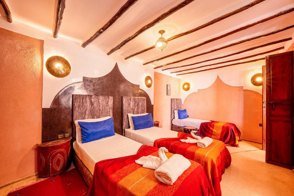Postel nebo postele na pokoji v ubytování Riad Sidi Mimoune & Spa