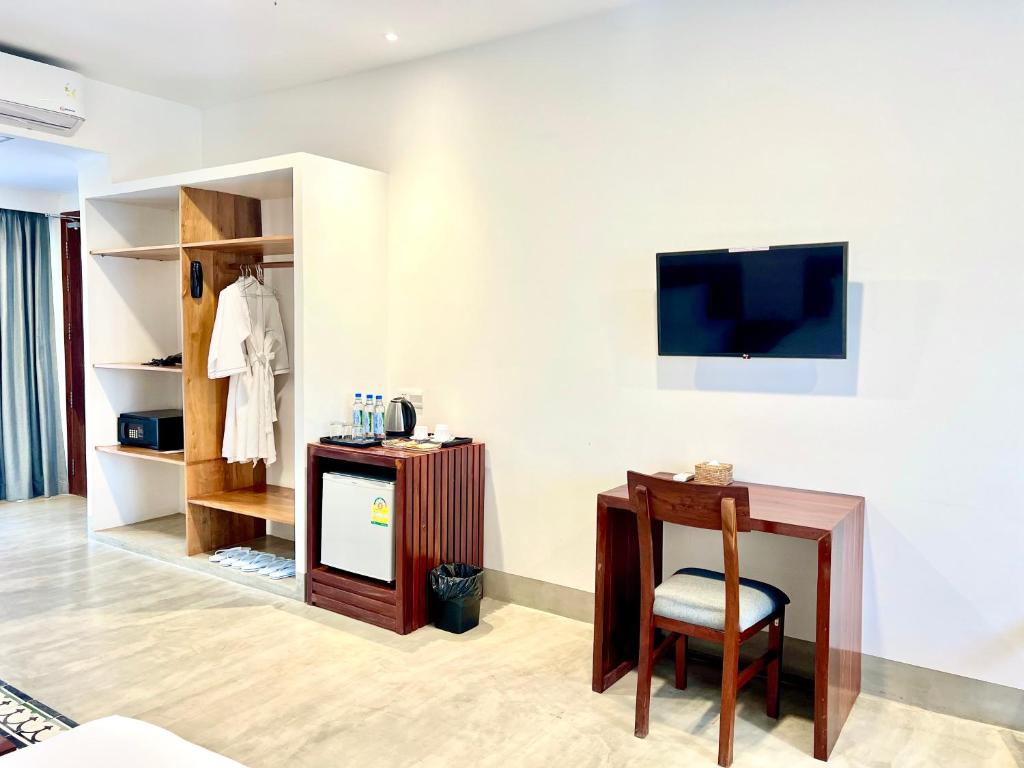 TV a/nebo společenská místnost v ubytování DACO Hotel