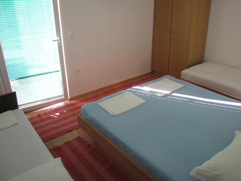 Postel nebo postele na pokoji v ubytování Apartments Primorac Podaca