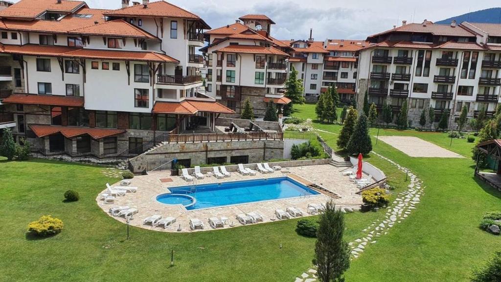 an aerial view of a large apartment complex with a swimming pool at Bansko Royal Towers Private Apartment V&K in Bansko
