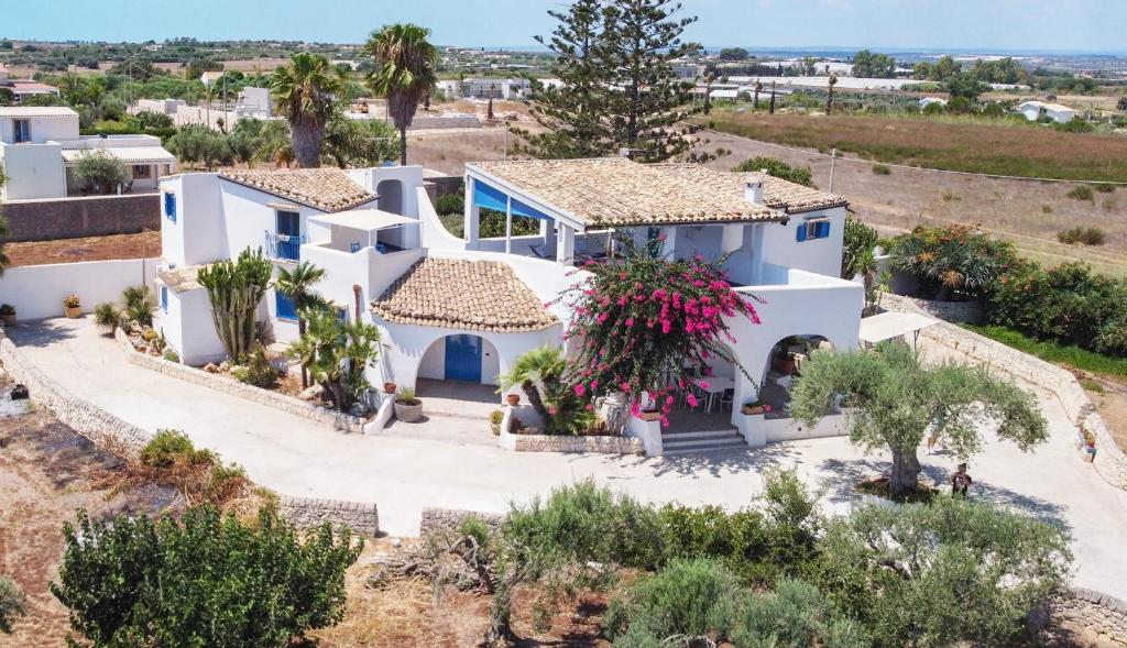 an aerial view of a white house with trees at Villa Le Charme Marin - Noto, Marzamemi, San Lorenzo in San Lorenzo
