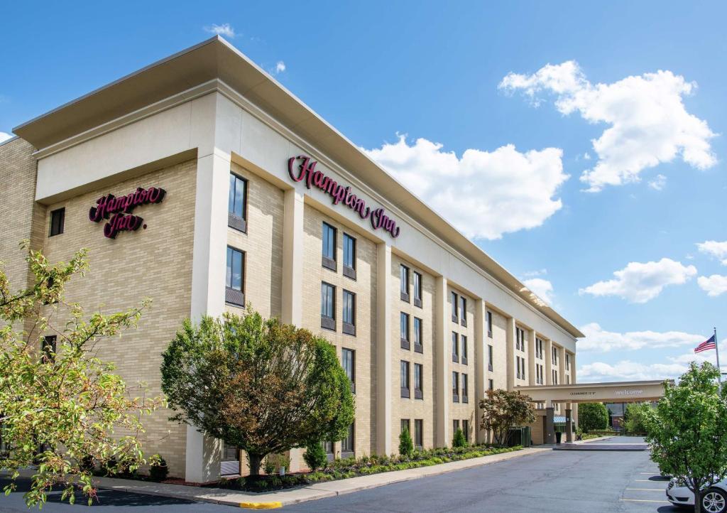 a building with a sign on the side of it at Hampton Inn Cleveland-Solon in Solon