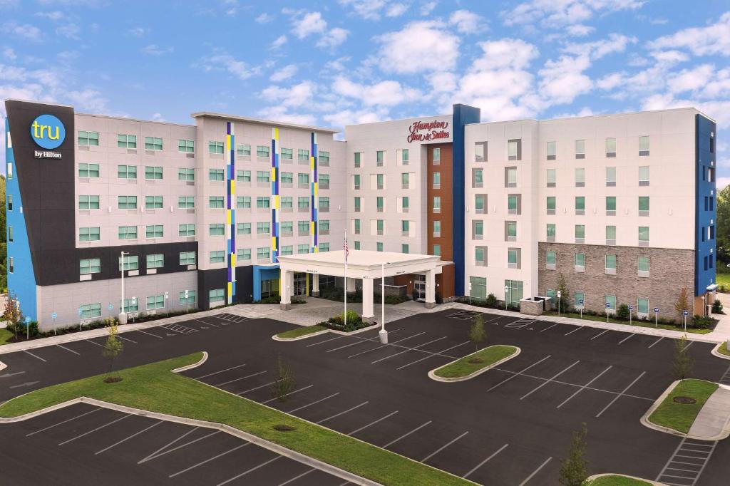 an empty parking lot in front of a hotel at Hampton Inn & Suites Charlotte Airport Lake Pointe in Charlotte