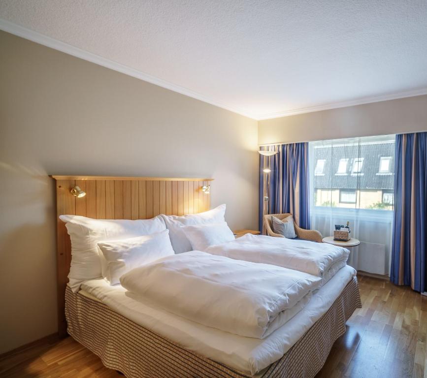 Postel nebo postele na pokoji v ubytování Hotel Refsnes Gods - by Classic Norway Hotels