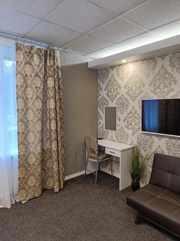 TV a/nebo společenská místnost v ubytování APARTHOTEL