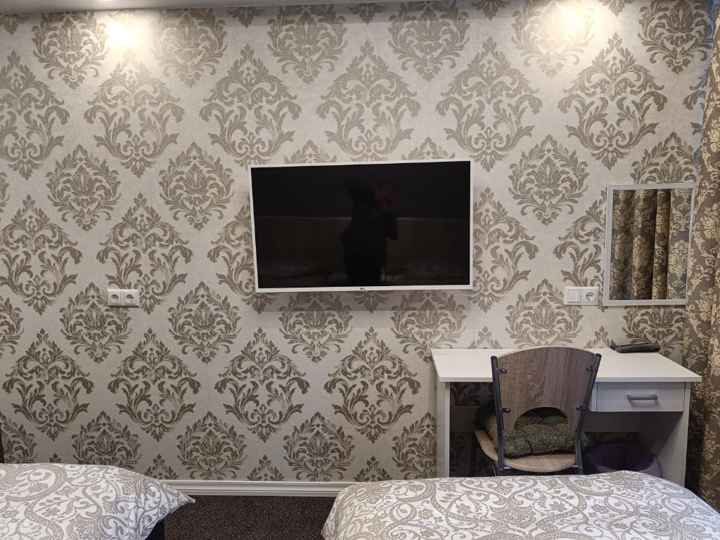 TV a/nebo společenská místnost v ubytování APARTHOTEL
