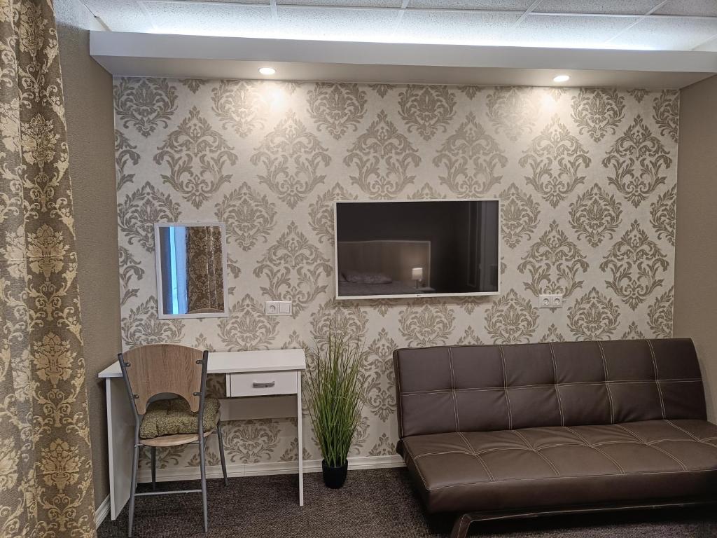 TV a/nebo společenská místnost v ubytování APARTHOTEL