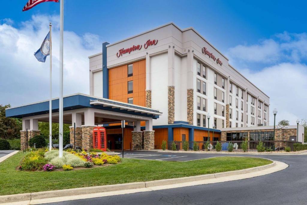 a hotel with a red phone booth in front of it at Hampton Inn Christiansburg/Blacksburg in Christiansburg