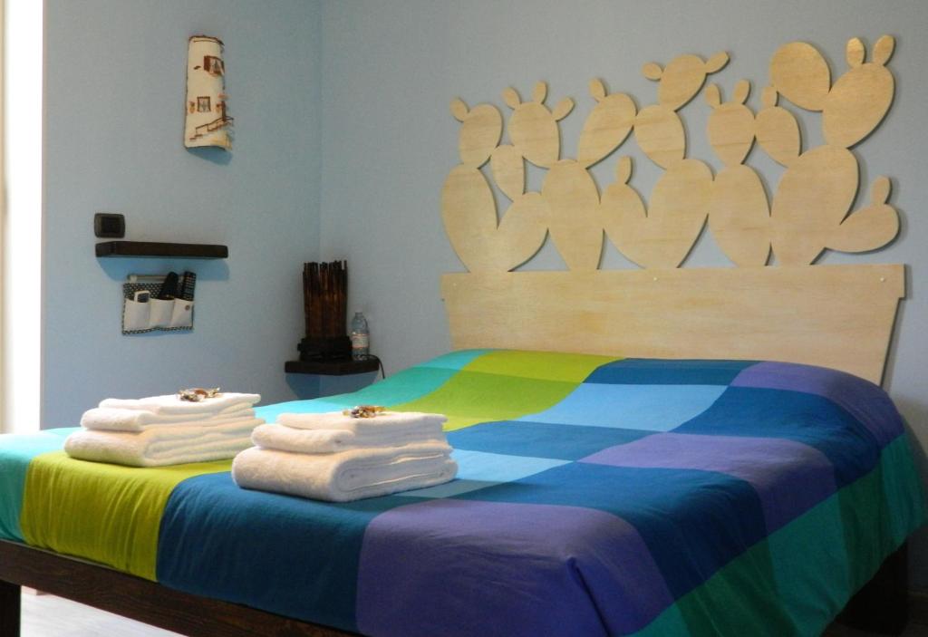 Postel nebo postele na pokoji v ubytování B&B San Leone