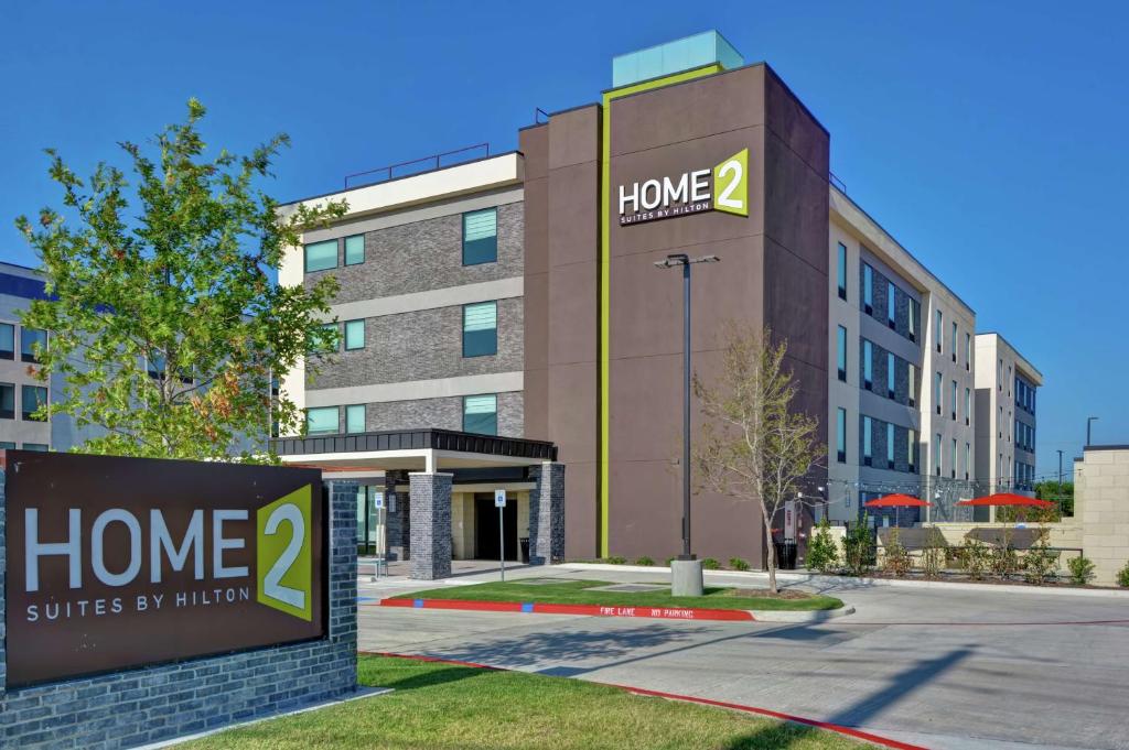 a home suites by higher sign in front of a building at Home2 Suites By Hilton McKinney in McKinney