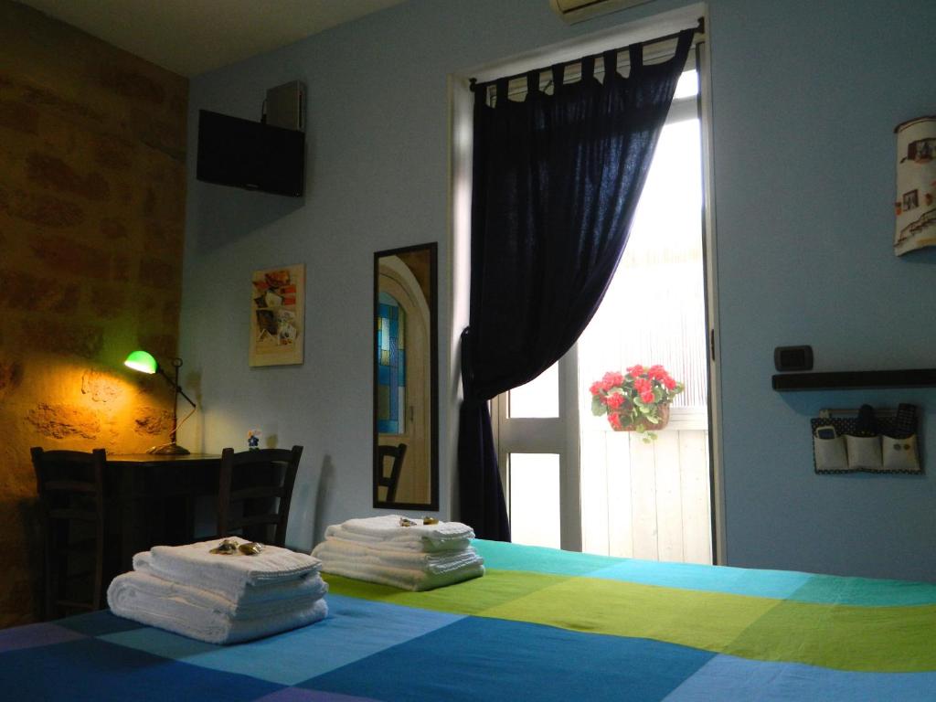 Postel nebo postele na pokoji v ubytování B&B San Leone