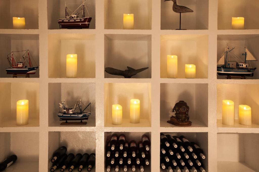 a wall with candles and candlesktop at AVANTI Lifestyle Hotel - Only Adults in Corralejo