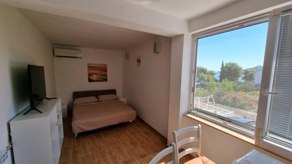 Postel nebo postele na pokoji v ubytování Apartments Ori