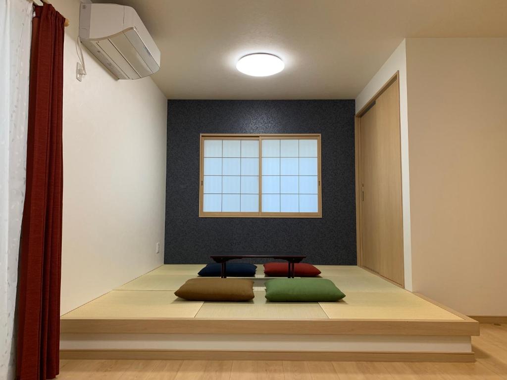 Postel nebo postele na pokoji v ubytování Guesthouse Kaede Annex