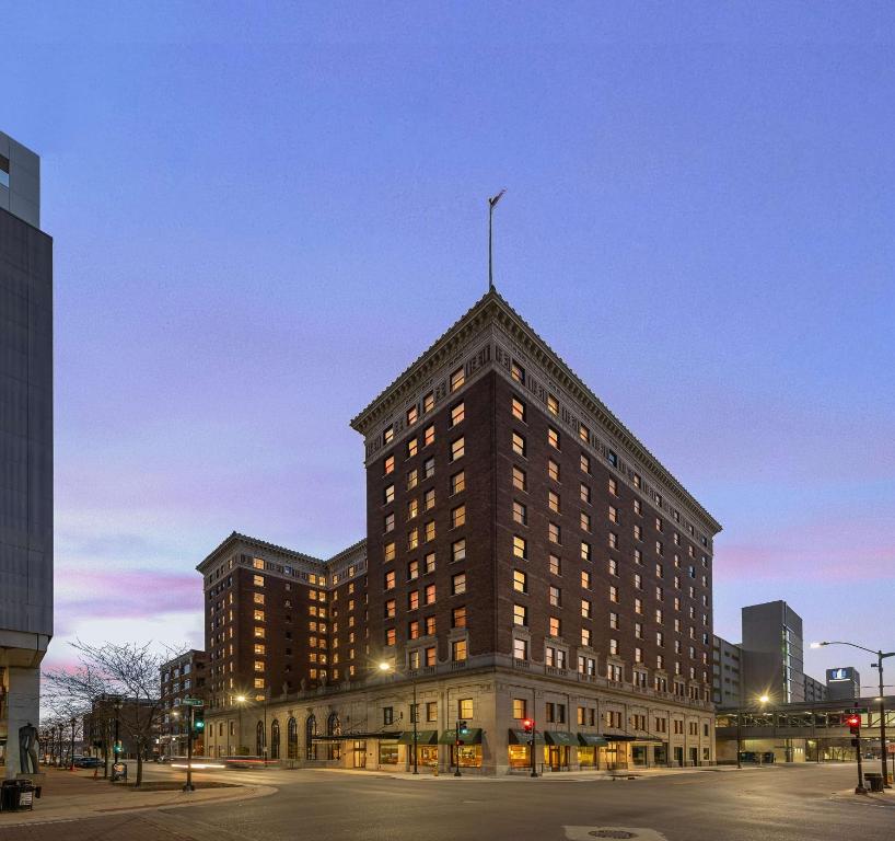 a large building with a flag on top of it at Hotel Fort Des Moines, Curio Collection By Hilton in Des Moines