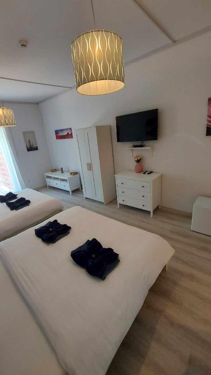 Postel nebo postele na pokoji v ubytování Herczeg Udvarház Poroszló